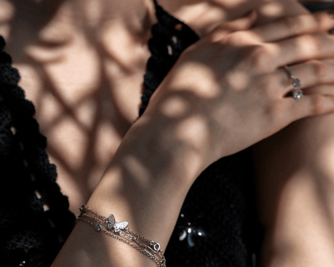 Larisa - Butterfly and Heart Charm Zirconia Solitaire Bracelet