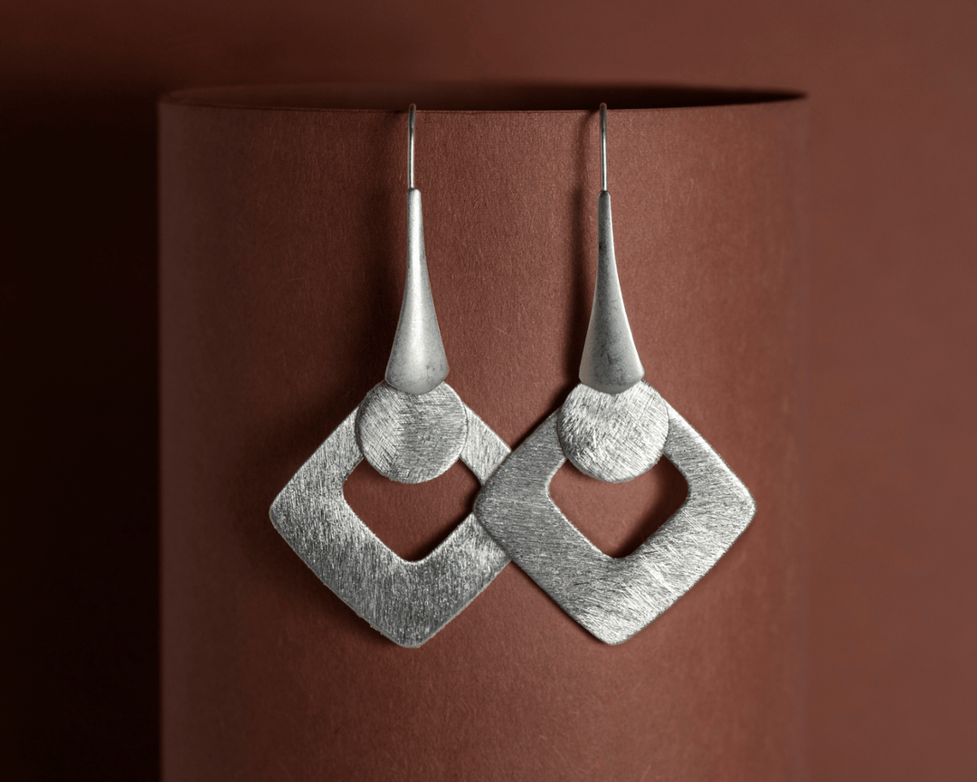 Ourea - Matte Finish Dangler Earrings: Silver and Rose Gold Finish